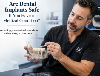 implant dentist explaining dental implant treatment using a jaw model